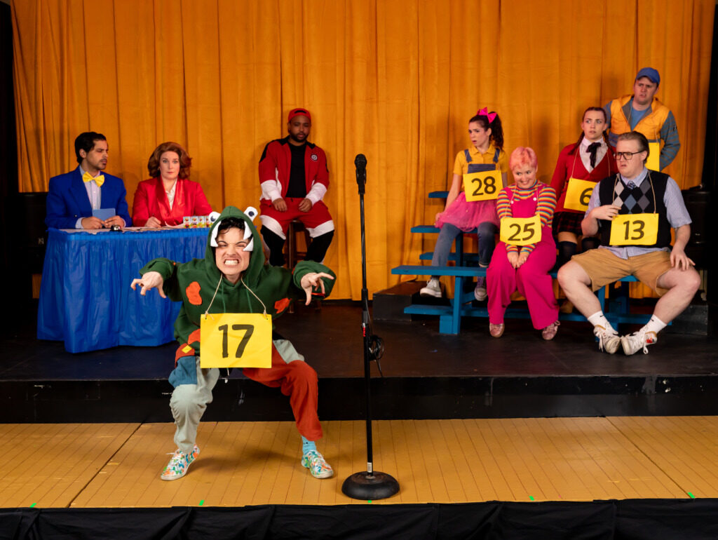 (L-R) Omar A. Said (Panch), Beth Amann (Rona Lisa), B.J. Robertson (Mitch), Taylor Litofsky (Logainne), Cera Baker (Marcy), Preston Grover (Chip), Sam Slottow (Leaf), Lila Cooper (Olive), and Stephen Emery (Barfée) in The 25th Annual Putnam County Spelling Bee, presented by Compass Rose Theater 📷