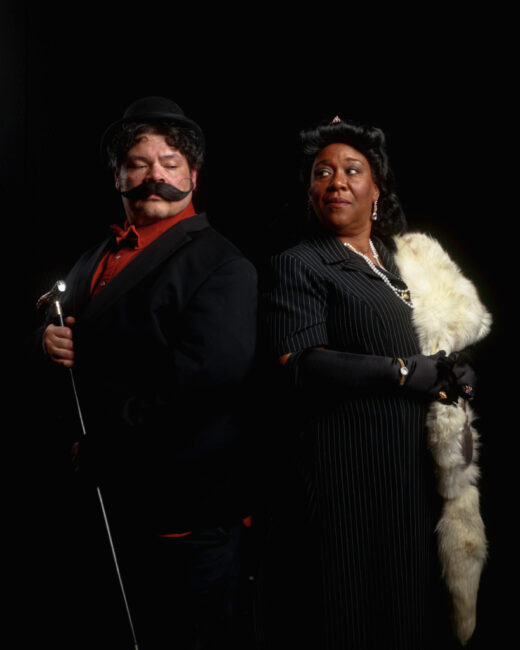 Jason Crawford (left) as Hercule Poirot and Melissa Fortson (right) as Countess Andrenyi in Murder On The Orient Express