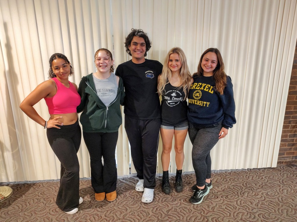 (From L to R) Allyson Gray as Regina George, Lillian Colon as Gretchen Wieners, Shahmeer Mirza as Damian Hubbard, Bella Comotto as Janis Sarkisian, and Talia Lebowitz as Karen Smith in Mean Girls (high school edition) at Children's Playhouse of Maryland