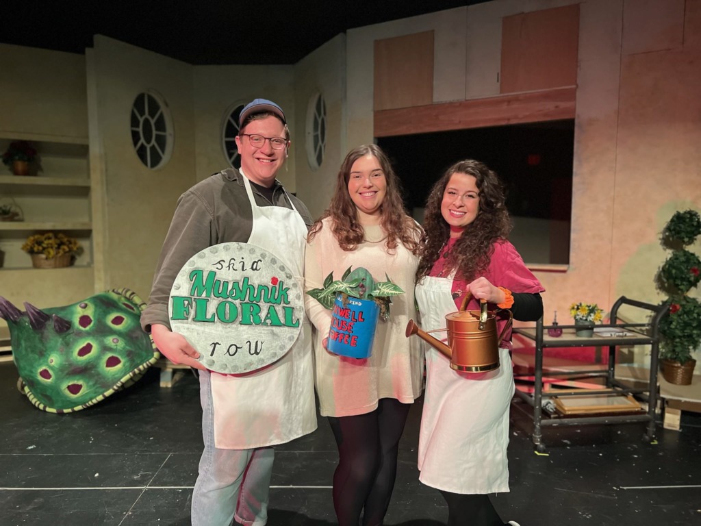 Ethan Keller (left) as Seymour with Sarah Johansen (center) as Audrey II and Ally Baca (right) as Audrey in Little Shop of Horrors