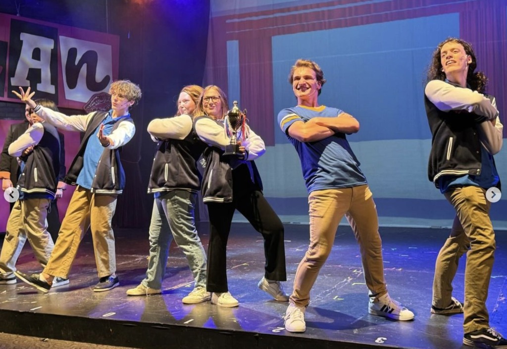 (L to R) Owen Ryscavage as Martin J., Teagle Walker as Kevin G., Reese Bruning as Cady Heron, Miranda Cockey as Ms. Norbury, Ethan Howard as Aaron Samuels, and Xander Bell as Tyler K. in Mean Girls (High School Edition) at Children's Playhouse of Maryland.