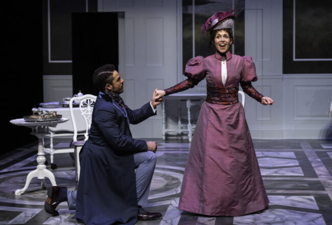Paul Deo Jr (left) as Jack Worthing and Veronica del Cerro (right) as Gwendolen Fairfax in The Importance of Being Earnest at Baltimore Center Stage 📷 Michael Henniger.