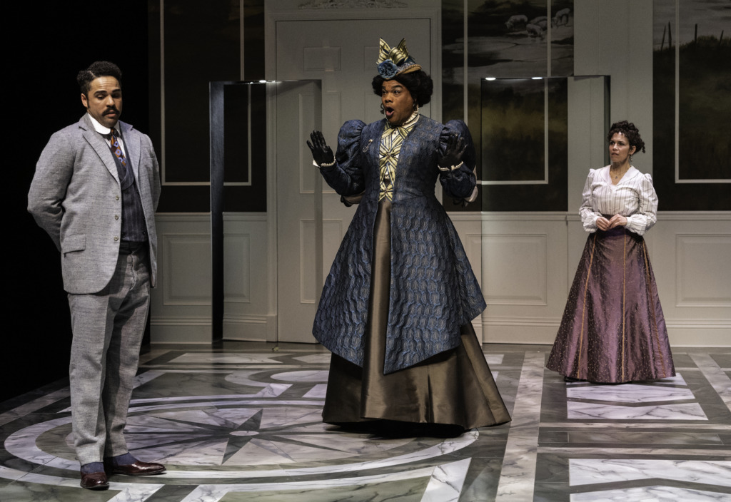 Paul Deo Jr (left) as Jack Worthing with David Ryan Smith (center) as Lady Bracknell and Veronica del Cerro (right) as Gwendolen Fairfax in The Importance of Being Earnest at Baltimore Center Stage 📷 Michael Henniger.
