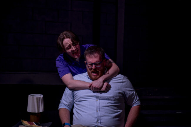 Jacob Albert Gross (behind) as Gabe and Matthew Peterson (in front) as Dan in Next To Normal at Street Lamp Community Theatre 📷SLCT