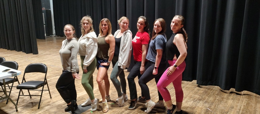 The Hot Box Dancers of Guys & Dolls at Tidewater Players posing mid-rehearsal