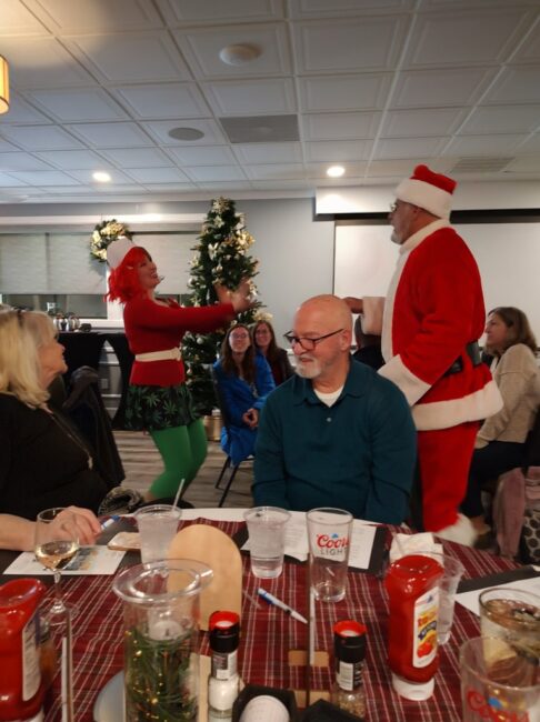 Erin Tarpley (left) as Merry Juana and Pat McPartlin (right) as Santa Claus in 'Murder on 34th Street' ????ANG Pix