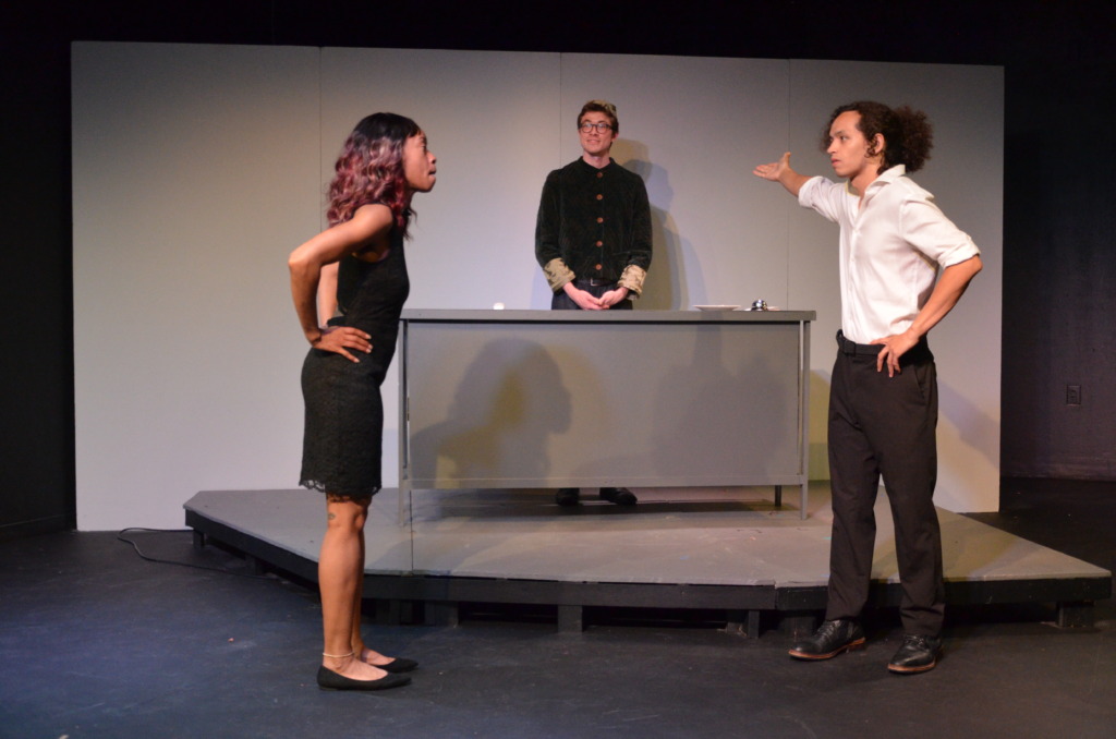 ReginaGinaG (left) as Maria with Pablo Akira (center) as Manager and Antony Ross Ocampo (right) as Andrei in 'The Nicest Hotel in All of Iceland' at Variations on Night with Rapid Lemon Productions 📷 Max Garner