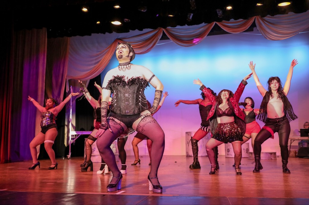 Eric Jones (center) as Frank-N-Furter in The Rocky Horror Show at MET & FCC