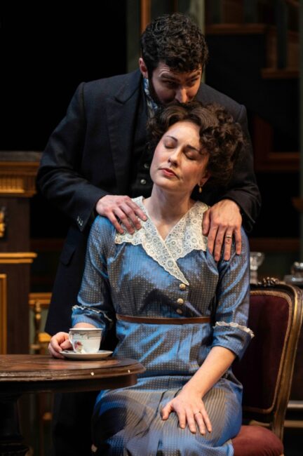 Zack Powell (behind) as Jack and Katie Kleiger (seated) as Bella in Deceived at Everyman Theatre 📷 Teresa Castracane Photography