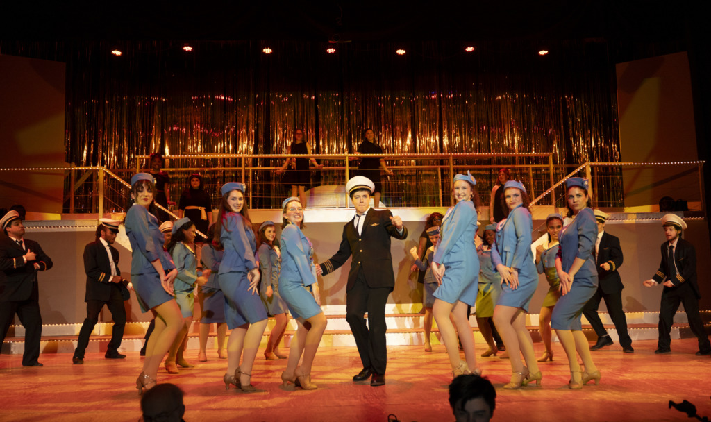 Michael Simpson (center) as Frank Abagnale Jr. and the cast of Catch Me If You Can at Suburban Players 📷 Austin Barnes