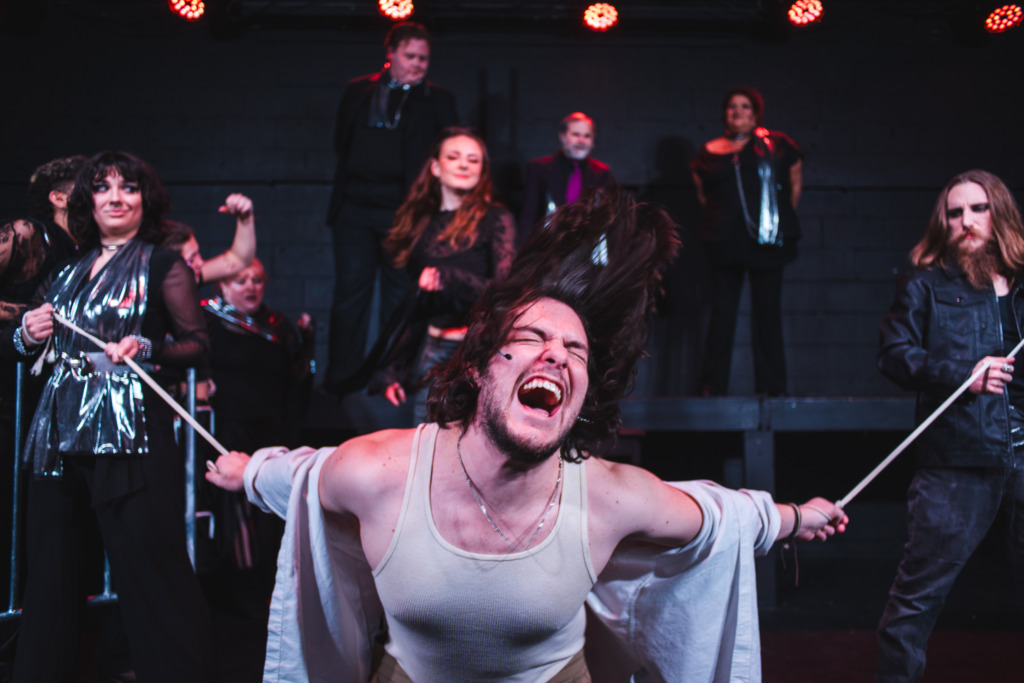 John Murphy (center) as Jesus and the cast of Jesus Christ Superstar at Street Lamp Community Theatre 📷 Machpe Photography
