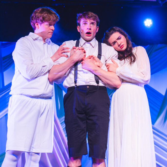 Stanley Evans (left) as Moritz with Jesse Hutchinson (center) as Melchior and Olivia Aubele (right) as Wendla in Spring Awakening at Tidewater Players 📷 Machpe Photography