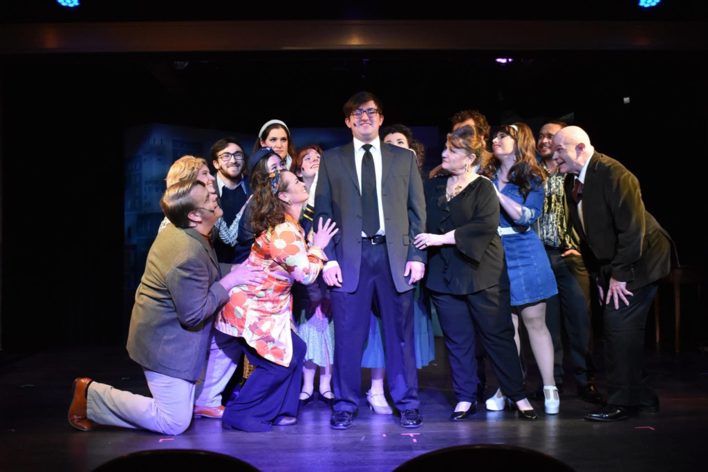 Ethan Kahwaty (center) as Bobby and the cast of Company at Damascus Theatre Company 📷 Elli Swink