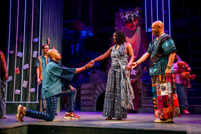 Manu KaKumasi (left) as Orlando with Tsilala Brock (center) as Rosalind and Jefferson A. Russell (right) as Duke Senior and the cast of As You Like It at Folger Theater 📷 Brittany Diliberto 