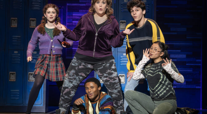 Emily Koch (center) as Debra and the cast of the National Tour of Kimberly Akimbo 📷 Joan Marcus