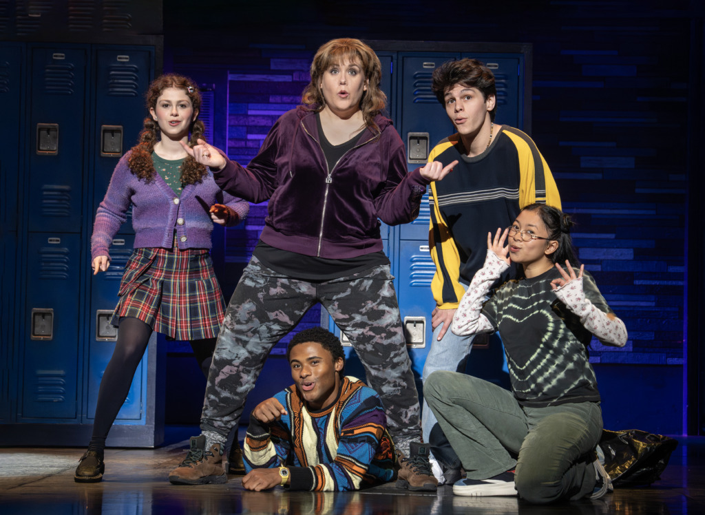 Emily Koch (center) as Debra and the cast of the National Tour of Kimberly Akimbo 📷 Joan Marcus