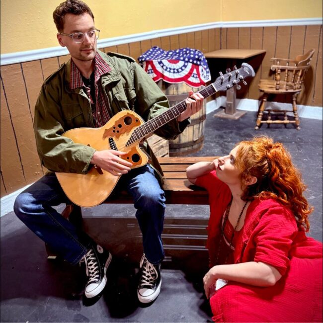 Thomas Digby (left) as John Hinckley Jr. and Melanie Kurstin (right) as Lynette 'Squeaky' Fromme  in Assassins at Laurel Mill Playhouse