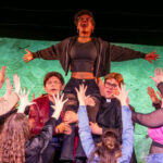 Isabel Bray (center) as Frankie Healy and the cast of Jagged Little Pill at Scottfield Theatre Company 📷 Sam Dixon