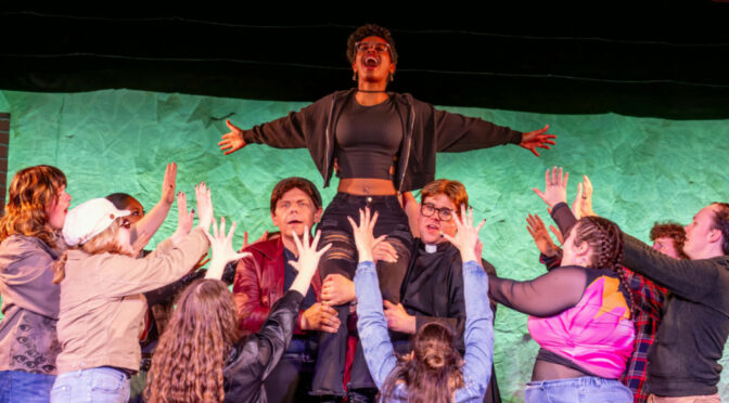Isabel Bray (center) as Frankie Healy and the cast of Jagged Little Pill at Scottfield Theatre Company 📷 Sam Dixon