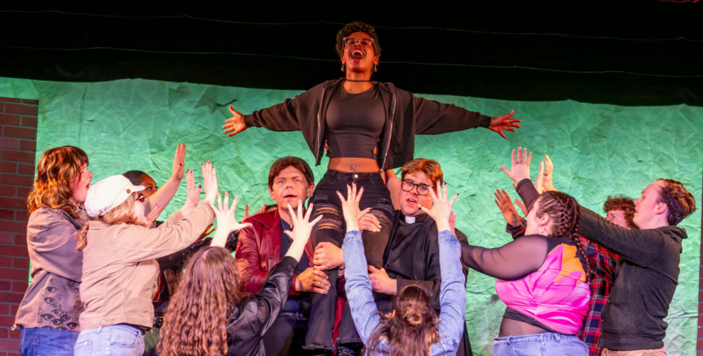 Isabel Bray (center) as Frankie Healy and the cast of Jagged Little Pill at Scottfield Theatre Company 📷 Sam Dixon