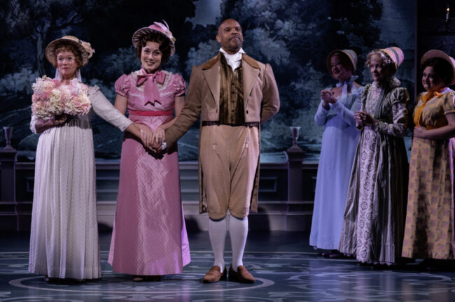 Katie Kleiger (centerish in pink) as Emma in Emma at Everyman Theatre 📷 Teresa Castracane Photography