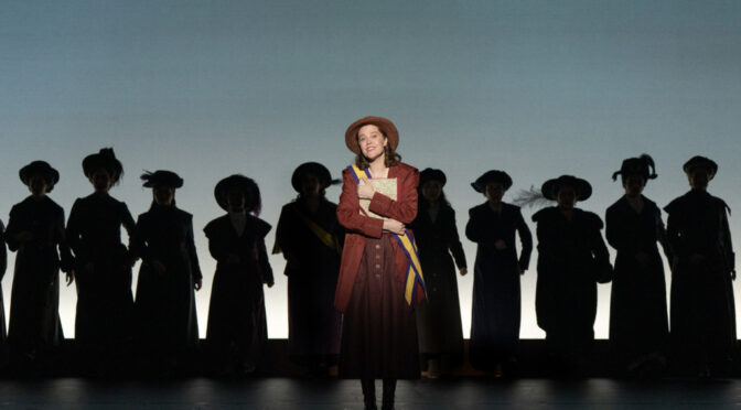 Maya Keleher (center) as Alice Paul in the First National Tour of Suffs 📷 Joan Marcus