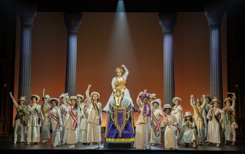 Monica Tulia Ramirez (center on horse) as Inez Milholland and the company of Suffs 📷 Joan Marcus
