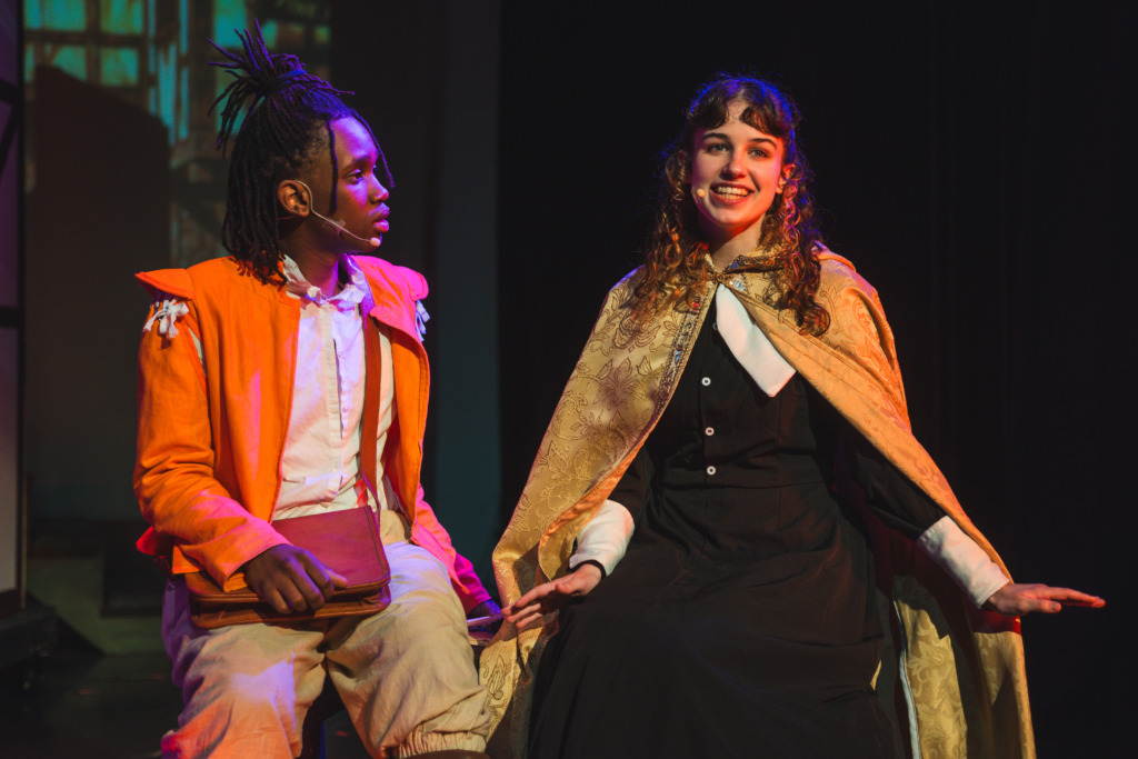 Alphan Nthuo (left) as Nigel Bottom and Izzie Parrish (right) as Portia in Something Rotten! at Theatreworks Live 📷Matthew Peterson