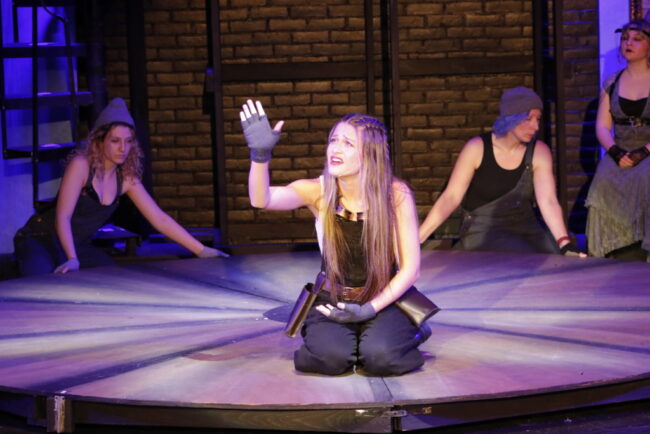 Lilah Fodel (center) as Eurydice in Hadestown (teen edition) at Children's Playhouse of Maryland 📷 Kelly Williams Carlson