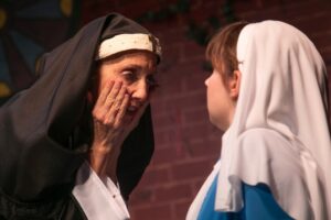 Holly Pascuillo (left) as Sister Acacius and Morgan Wenerick (right) as Agnes in The Divine Sister at Vagabond Players 📷 Shealyn Jae Photography