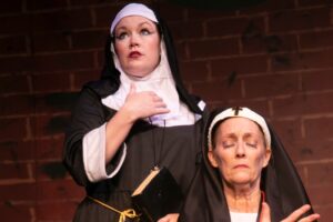 Maeve Koch (left) as Sister Walburga and Holly Pascuillo (right) as Sister Acacius in The Divine Sister at Vagabond Players 📷 Shealyn Jae Photography