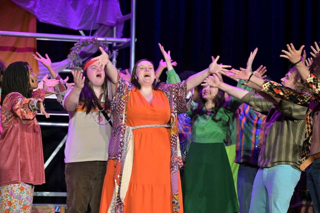Michael Bauerlein (center left) as Claude and Alexandra Overby (center right) as Ronny and the Tribe of Hair at Small Town Stars Theatre Company 📷 Mort Shuman