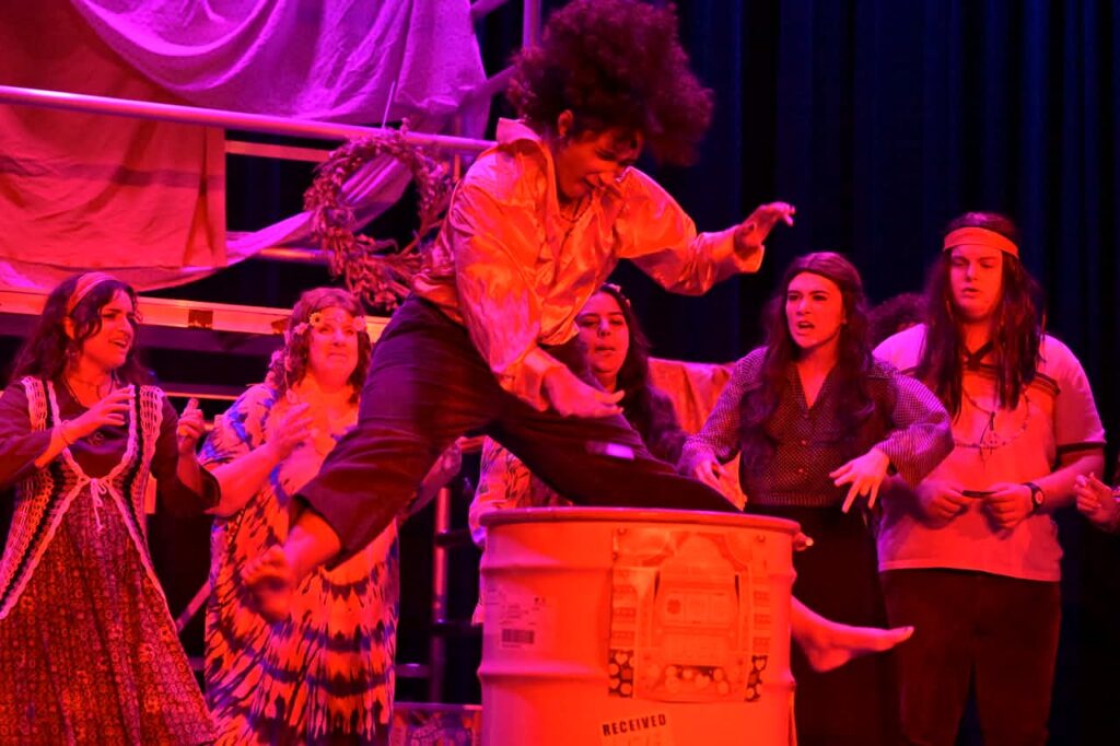 Chiamaka Nwokeji (center) as Berger and the Tribe of Hair at Small Town Stars Theatre Company 📷 Mort Shuman