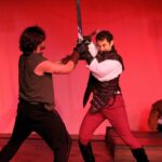 Pete Sheldon (left) as Prince Hal and Steven Todd Smith (right) as Hotspur in Henry IV Part 1 with Unstrung Harpist đˇ Cody James