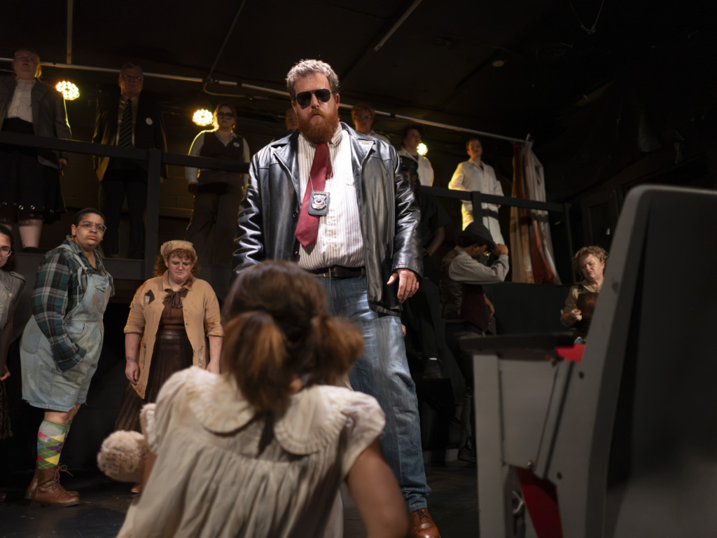 Matt Peterson as Officer Lockstock in Urinetown at Street Lamp Community Theatre đˇ Austin Barnes
