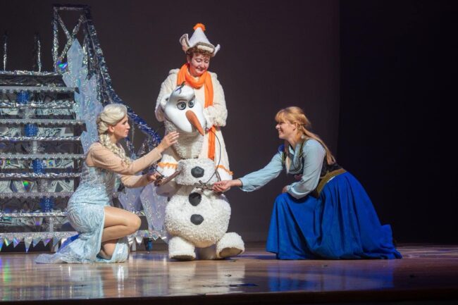 Amber Bates (left) as Elsa with Oliva Ward (center) as Olaf and Alyson Kaiser (right) as Anna in Disney's Frozen at Glyndon Area Players